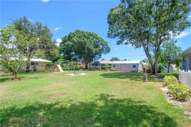 1018 Persian Ln, Sebastian, FL 32958 - view of green lawn featuring a playground
