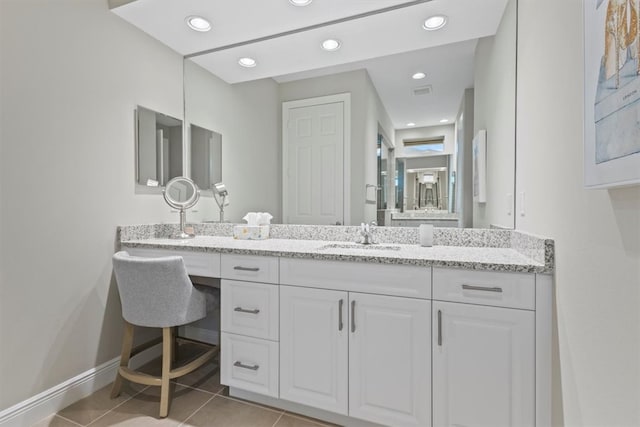 bathroom with vanity and tile patterned flooring