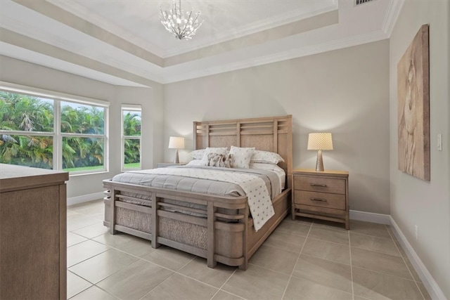 tiled bedroom with an inviting chandelier, ornamental molding, and a raised ceiling