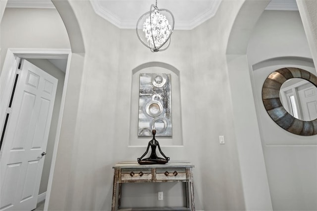 interior details with stacked washing maching and dryer and ornamental molding