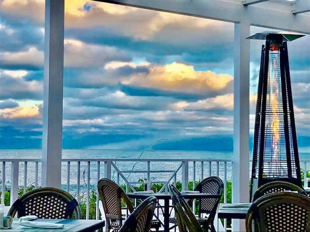 balcony at dusk with a water view