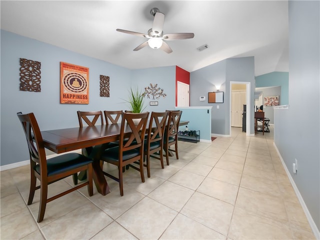 tiled dining space featuring ceiling fan