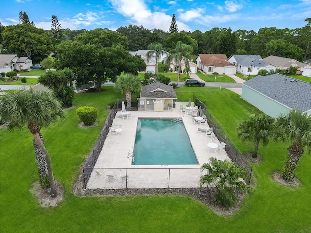 view of swimming pool with a yard and a patio