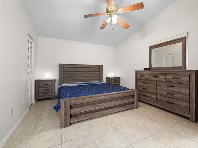 bedroom featuring a closet, light tile patterned floors, and ceiling fan