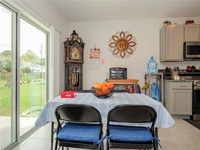 dining space with light tile patterned floors