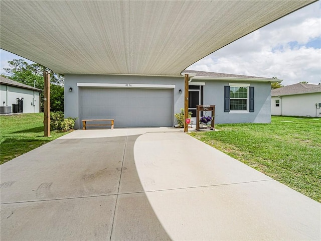 ranch-style house with an attached garage, a front yard, concrete driveway, and stucco siding