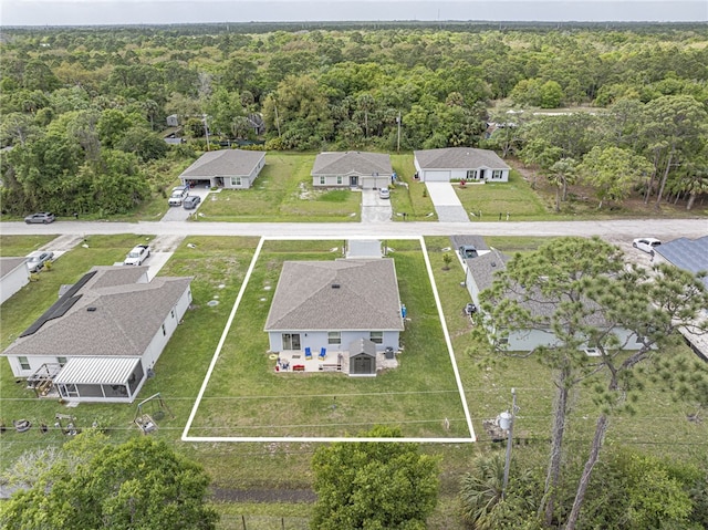 aerial view featuring a wooded view