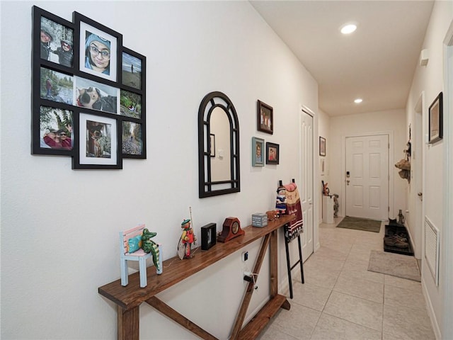 hallway featuring recessed lighting and light tile patterned floors