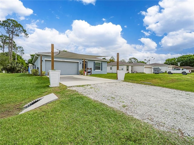 single story home with a garage, a front lawn, and concrete driveway