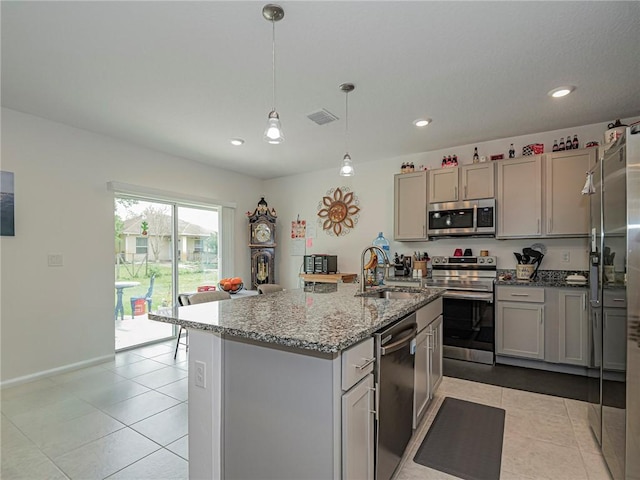 kitchen featuring stainless steel appliances, visible vents, a sink, and light tile patterned floors