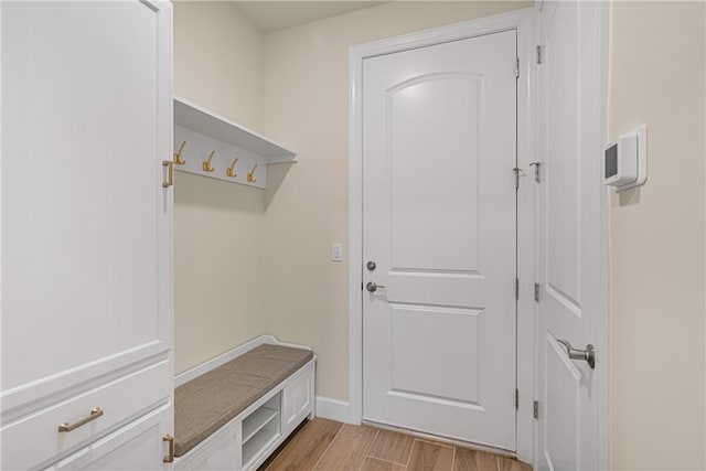 mudroom with light hardwood / wood-style floors