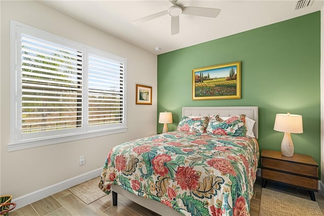 bedroom featuring hardwood / wood-style floors and ceiling fan