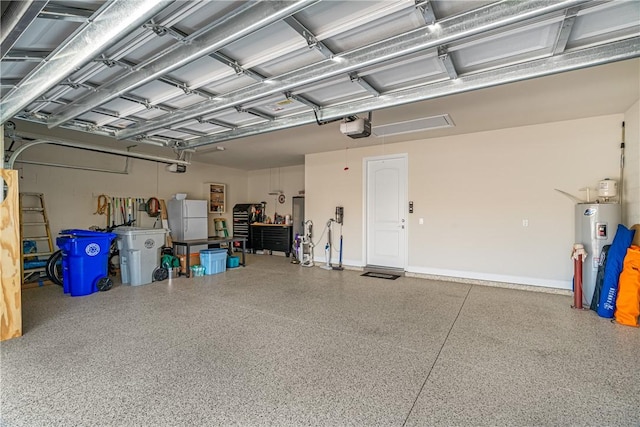 garage featuring white refrigerator, a garage door opener, and electric water heater