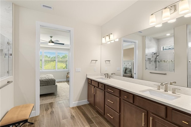 bathroom featuring vanity and a tile shower