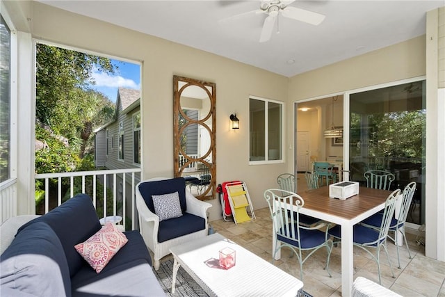 sunroom with ceiling fan