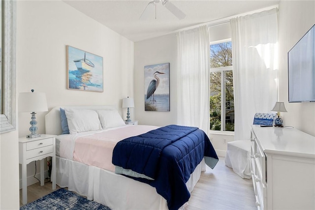 bedroom featuring light wood finished floors and ceiling fan