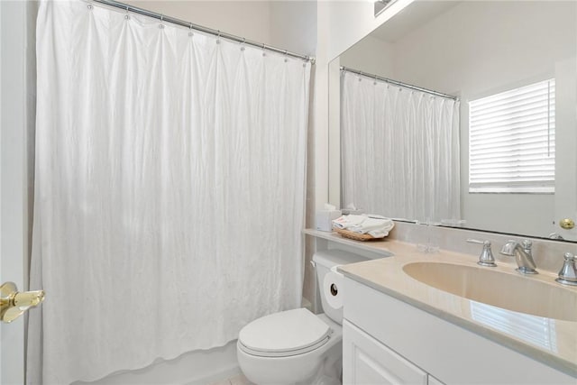 bathroom with toilet, vanity, and shower / bath combination with curtain