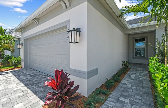 1279 Harper Way Unit 013, Vero Beach, FL 32960 - garage with decorative driveway