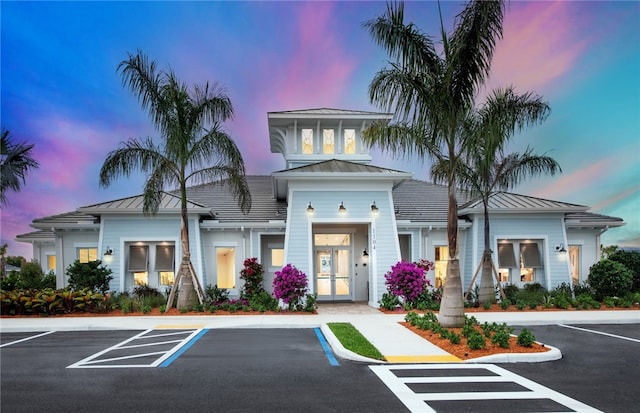 1279 Harper Way Unit 013, Vero Beach, FL 32960 - view of building exterior with uncovered parking