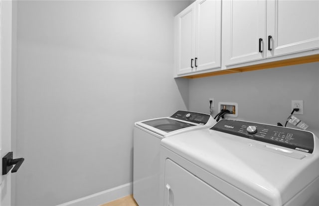 1279 Harper Way Unit 013, Vero Beach, FL 32960 - washroom featuring cabinet space, separate washer and dryer, and baseboards