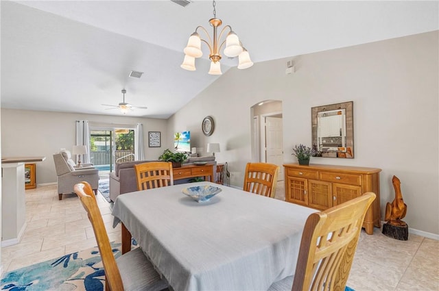 dining room with visible vents, baseboards, lofted ceiling, ceiling fan with notable chandelier, and arched walkways