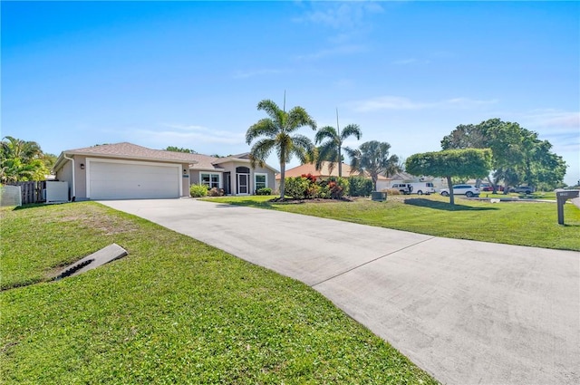 view of front of house featuring stucco siding, driveway, a front lawn, and a garage