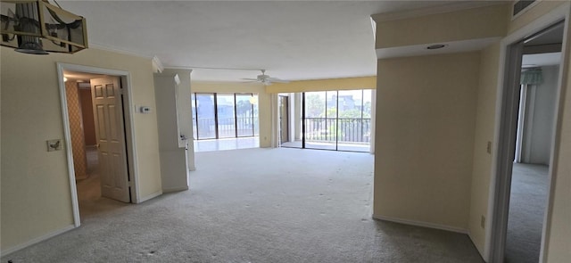 1850 Bay Rd Unit 3F, Vero Beach, FL 32963 - carpeted empty room with ornamental molding and ceiling fan