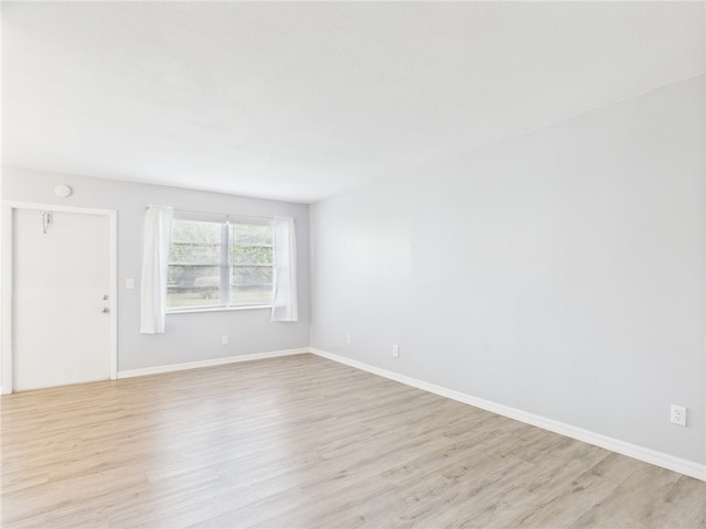 96 Spring Lake Dr Unit 105, Vero Beach, FL 32962 - empty room with light wood-style flooring