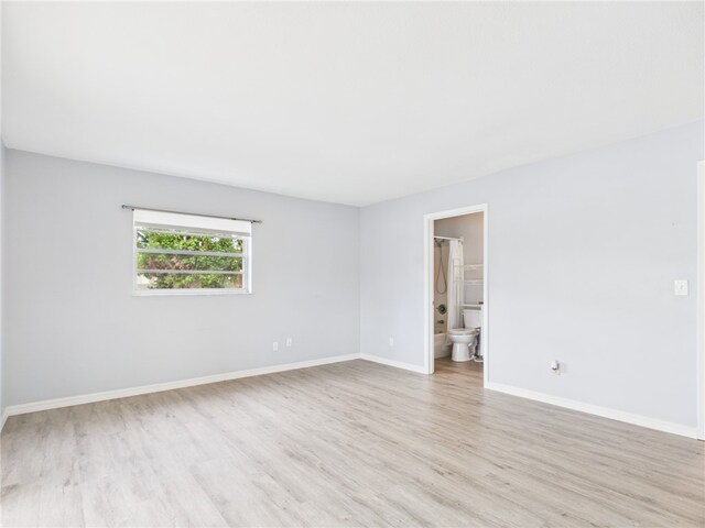 96 Spring Lake Dr Unit 105, Vero Beach, FL 32962 - spare room featuring light wood-style flooring and baseboards