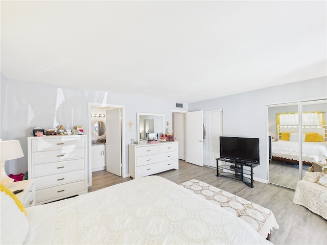 96 Spring Lake Dr Unit 105, Vero Beach, FL 32962 - bedroom featuring wood finished floors and baseboards