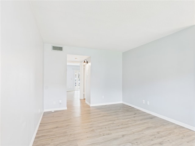 96 Spring Lake Dr Unit 105, Vero Beach, FL 32962 - unfurnished room with light wood-type flooring and baseboards