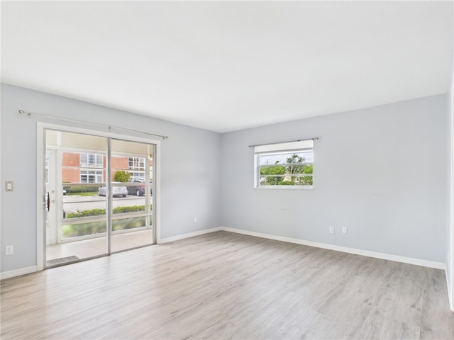 96 Spring Lake Dr Unit 105, Vero Beach, FL 32962 - empty room featuring light wood finished floors and baseboards