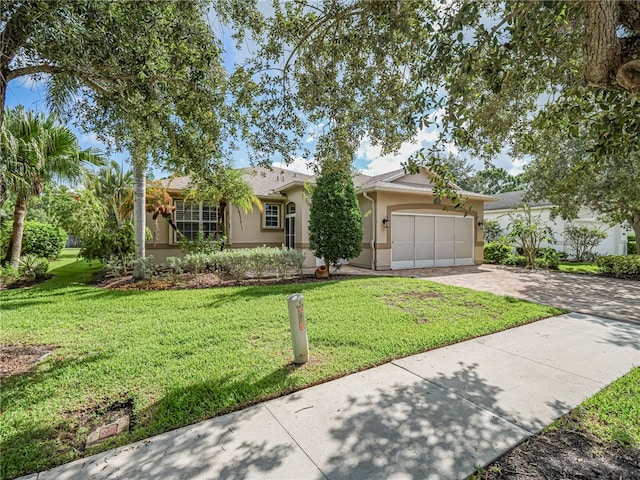 ranch-style house with a front lawn and a garage