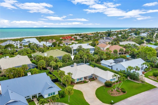 drone / aerial view with a water view and a residential view