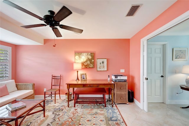 office space featuring ceiling fan, light tile patterned floors, visible vents, and baseboards