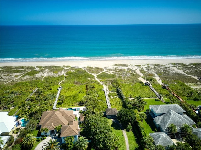 bird's eye view with a water view and a view of the beach