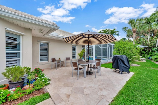 view of patio with grilling area and a lanai