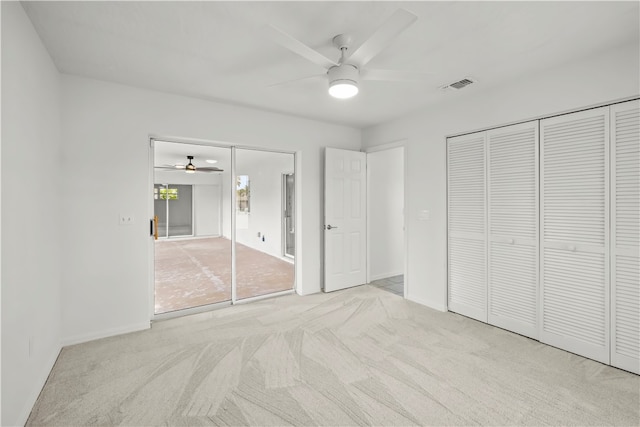 unfurnished bedroom with light carpet and ceiling fan