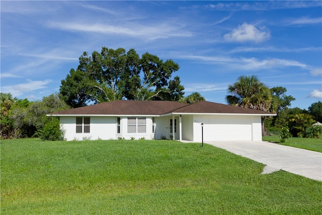 ranch-style house featuring a front yard and a garage