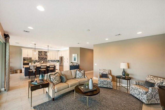 11706 SW Brighton Falls Dr, Port St Lucie, FL 34987 - living area with recessed lighting