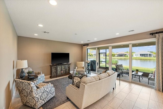 11706 SW Brighton Falls Dr, Port St Lucie, FL 34987 - living area featuring recessed lighting and light tile patterned flooring