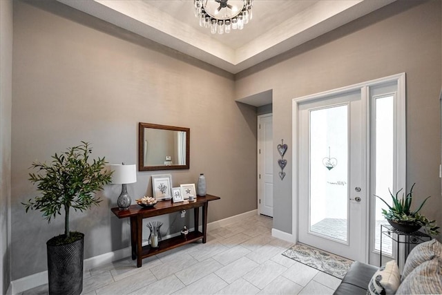 11706 SW Brighton Falls Dr, Port St Lucie, FL 34987 - foyer entrance featuring a chandelier and baseboards