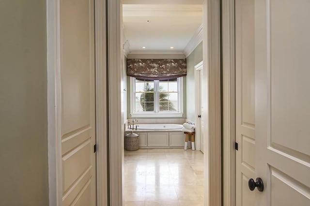 hall featuring ornamental molding and light tile patterned floors