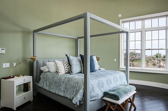 bedroom featuring dark hardwood / wood-style flooring