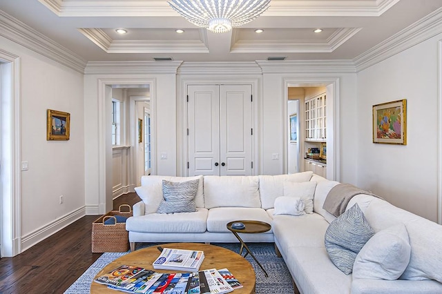 living room featuring coffered ceiling, a chandelier, crown molding, and dark hardwood / wood-style floors