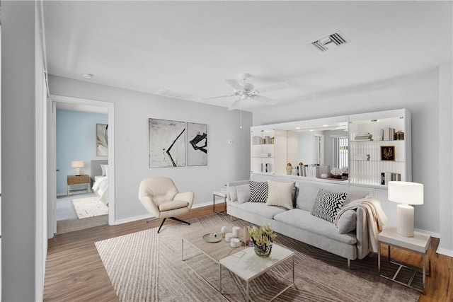 640 N Centre Ct SW Unit 102, Vero Beach, FL 32962 - living room with wood finished floors and a ceiling fan