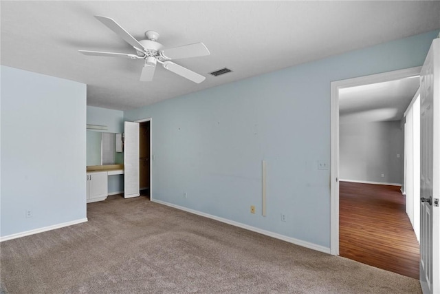 640 N Centre Ct SW Unit 102, Vero Beach, FL 32962 - unfurnished bedroom featuring carpet and ceiling fan