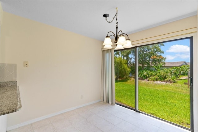 640 N Centre Ct SW Unit 102, Vero Beach, FL 32962 - unfurnished dining area with a chandelier and light tile patterned floors