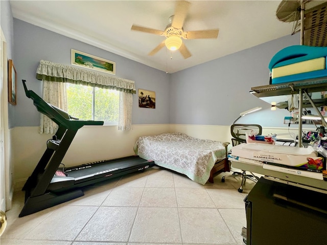 bedroom with ceiling fan and tile patterned flooring