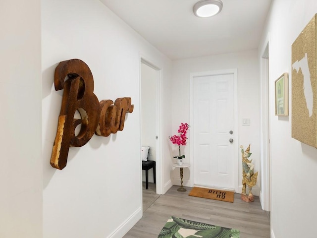 hallway with light wood-type flooring